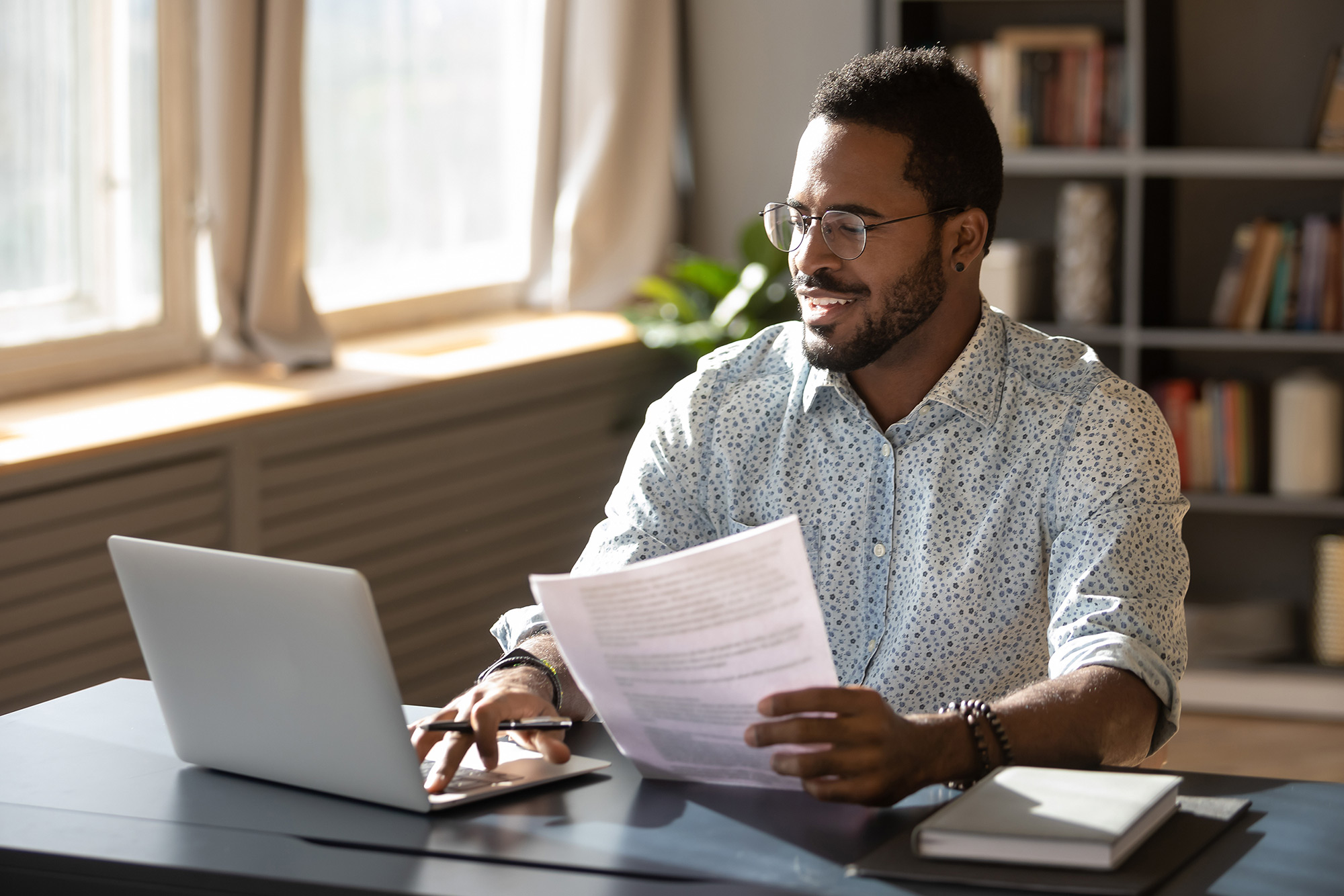 Happy man examining condo documents