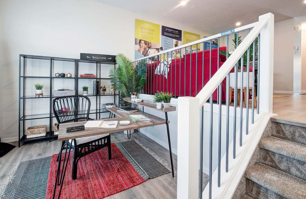 work space with a desk, chair and book shelves