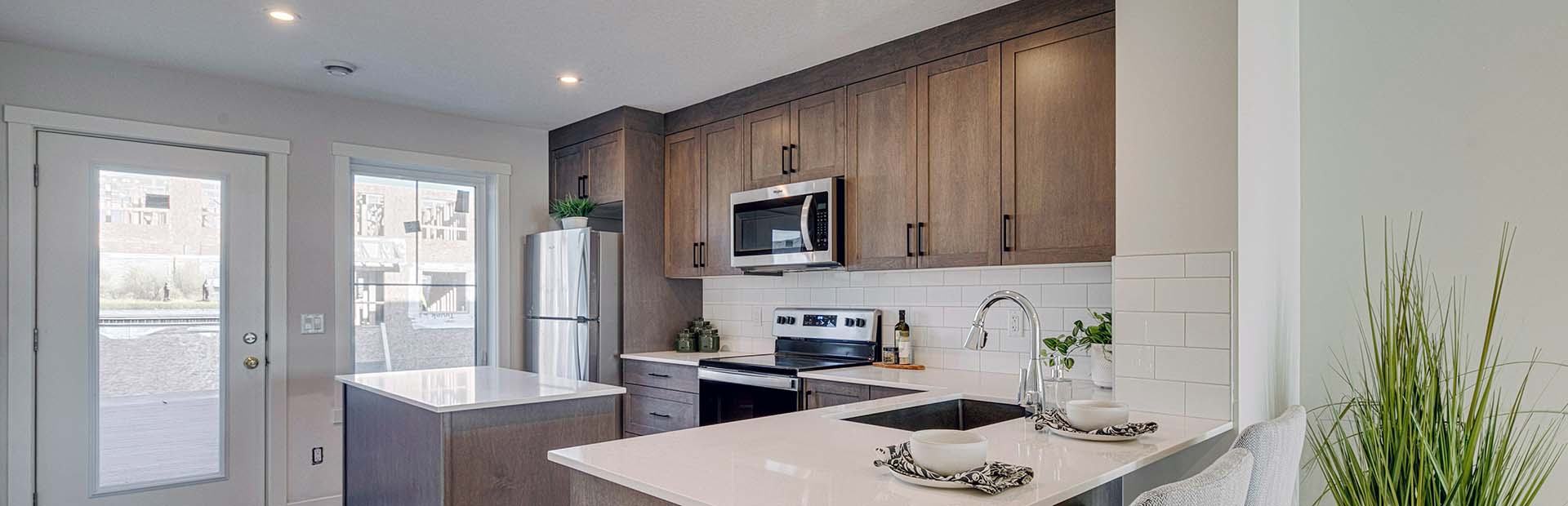 A bright and modenr ZEN townhome kitchen.