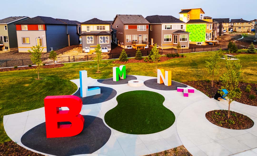 Colorful modern playground equipment at ZEN Belmont community amenities in Southwest Calgary by Avalon Homes