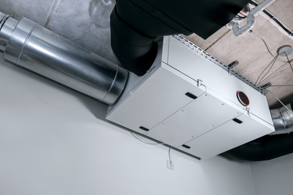 Heat recovery ventilation (HRV) system installed in the mechanical room with connected ductwork for improved indoor air quality.