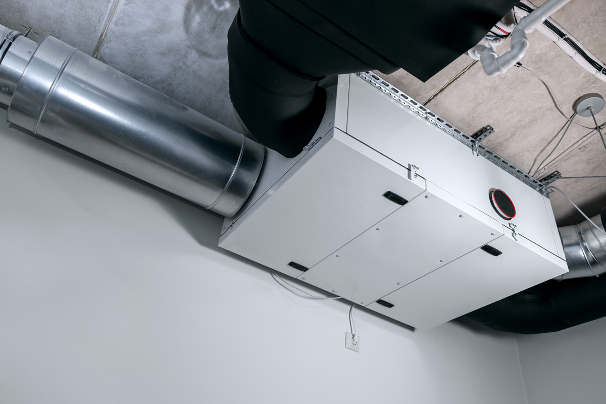 Heat recovery ventilation (HRV) system installed in the mechanical room with connected ductwork for improved indoor air quality.