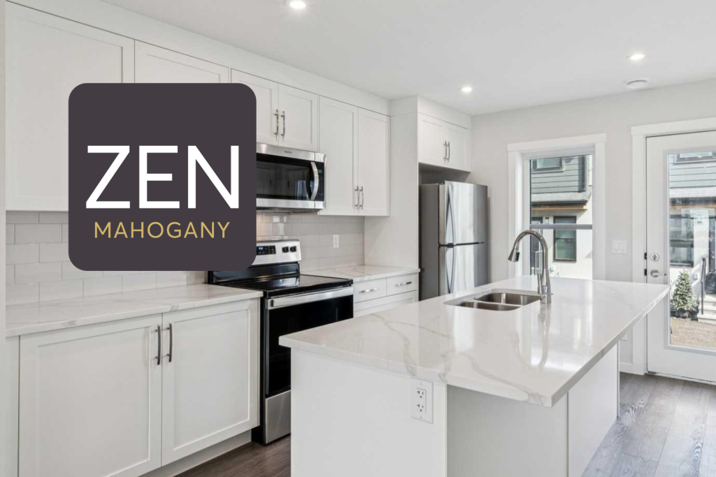 White kitchen cabinets with stainless steel appliances and window and door looking to the backyard